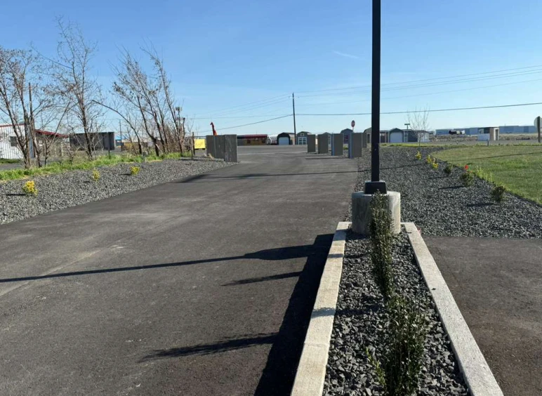 Empty parking lot under clear sky