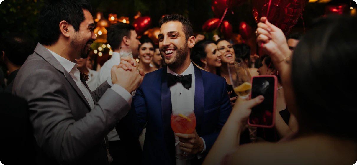 Group having fun with drinks and balloons